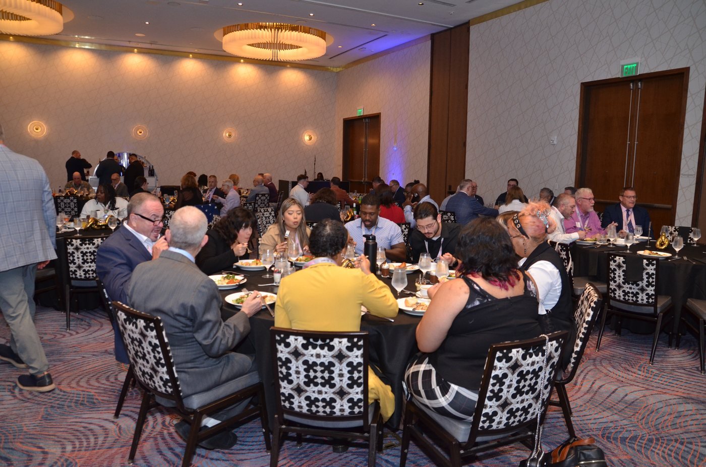 A full ballroom of seated guests during an awards gala at The Wave Hotel, Lake Nona