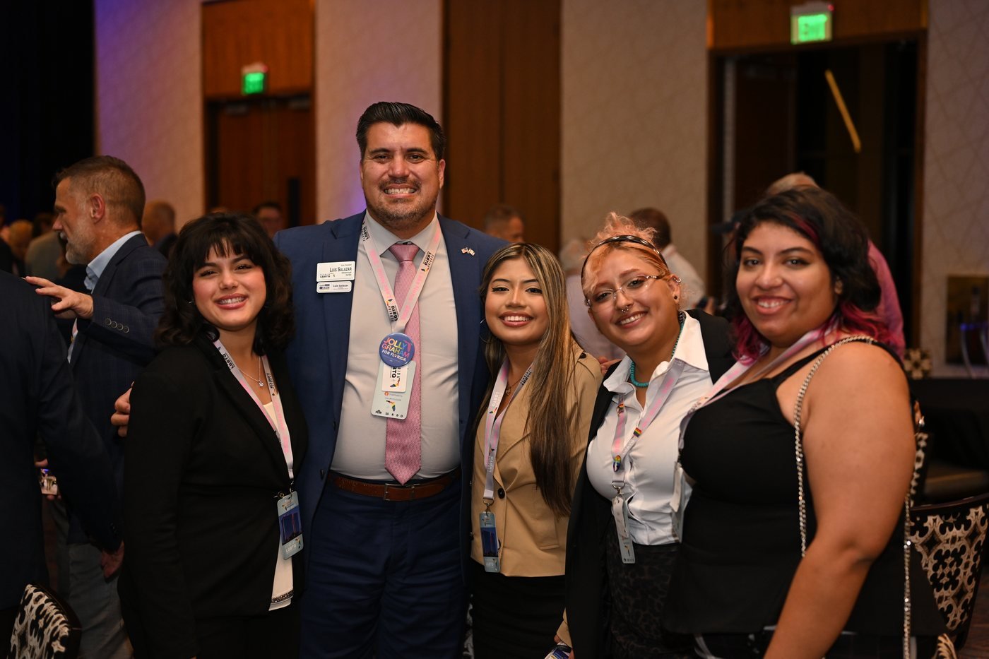 Guests raising a glass together at a corporate reception in Orlando