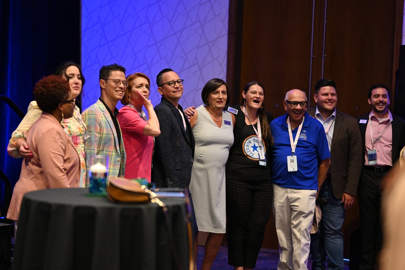 A large group gathered on stage at the close of an awards programme