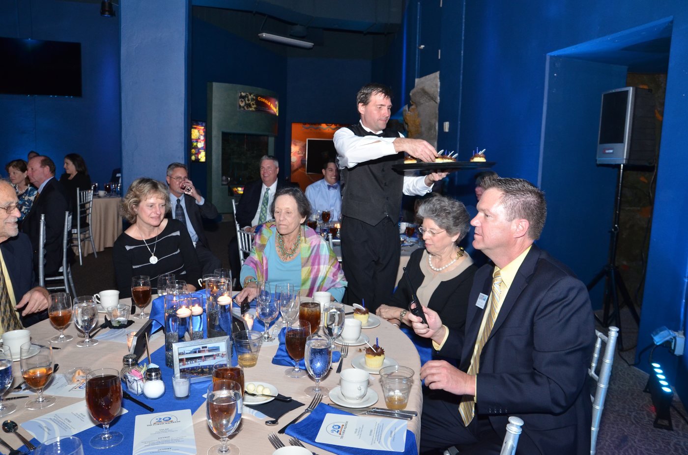 Guests seated for dinner as service begins at The Florida Aquarium, Tampa
