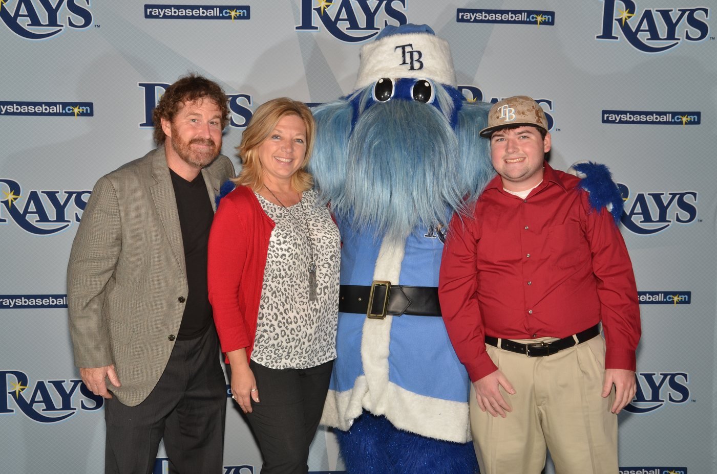 Guests photographed with the team mascot at a sponsor activation at Tropicana Field, St. Petersburg